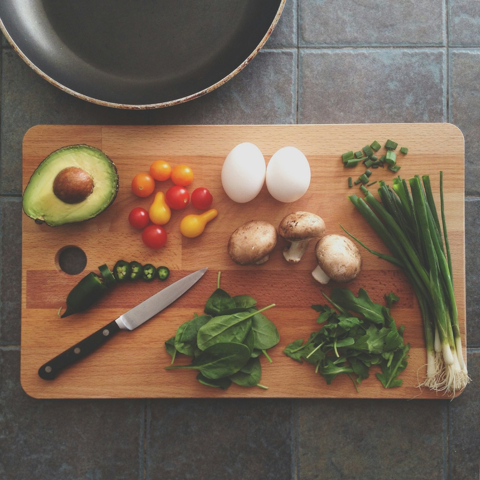 Clean professional kitchen workspace with fresh ingredients